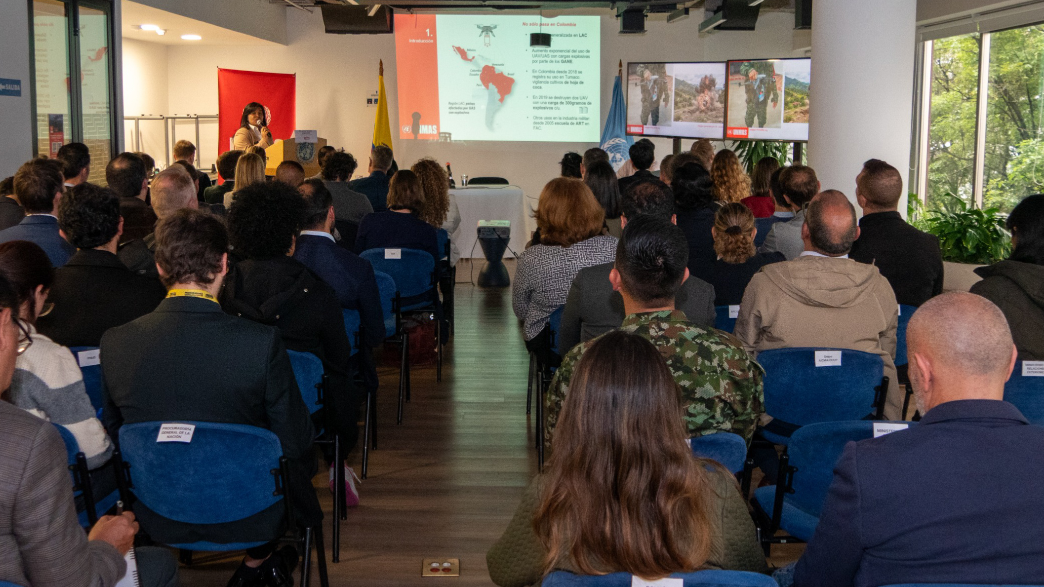 people sitting down looking at a presentation