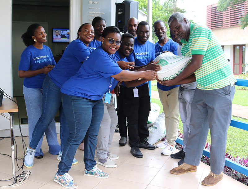 UNFCU Staff hand  over fertilizers