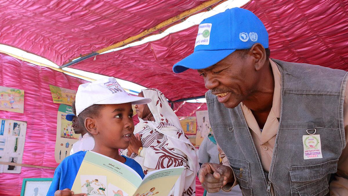 a man is talking to a boy