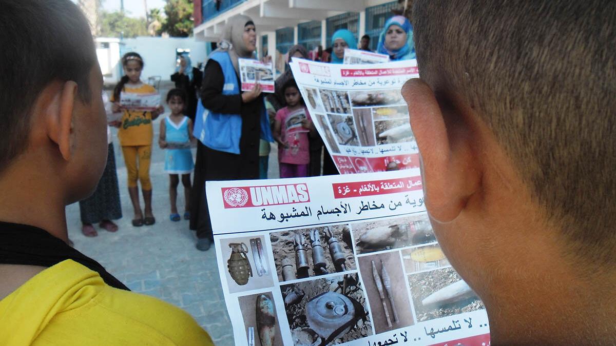 School teacher providing ERW risk education to children in Beit Hanoun.