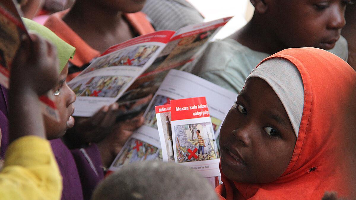 a close-up shot of a child looking back