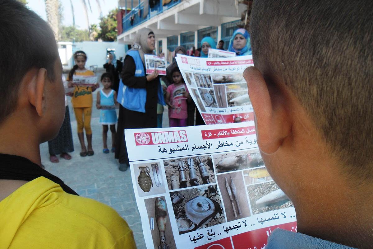 School teacher providing ERW risk education to children in Beit Hanoun.