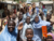 Children waving goodbye to the UNMAS team at the end of their Explosive Ordnance Risk Education session, showing some of the information, education and communication materials distributed by the UNMAS teams. UNMAS Photo. 