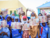 Girls display leaflets with information on how to be safe when confronted by explosive ordnance, during a Japanese-funded UNMAS EORE session in Bolibe village, Borno State, Nigeria. UNMAS Photo/Stefan De Coninck.