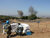 Chinese and Cambodian UNIFIL deminers stand at a safety distance as they conduct demolitions to the mines they found during the day. ©️ UNMAS