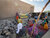 Women and children attend an explosive risk education session right in their backyard in a neighbourhood of Timbuktu, by MAG/AMSS CLOs in August 2021. Home visits and door-to-door education sessions offer a unique opportunity to reach all family members and deliver life-saving messages in a more comfortable and confidential environment. Photo: UNMAS/Serge Ouedraogo